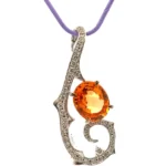 K18WG スペサルティンガーネット・ダイヤモンド ブローチ 3.63・0.35ct