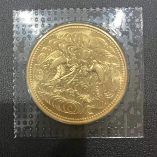 天皇陛下御在位60年記念10万円金貨
