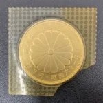 天皇陛下御在位60年記念10万円金貨